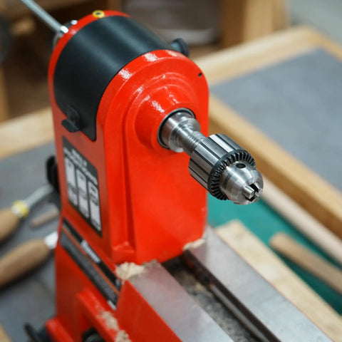 Heavy Duty Drill Chuck Set 5/8 Inch Capacity With JT33 MT2 And JT33 MT1 Taper Arbors attached to red lathe machine