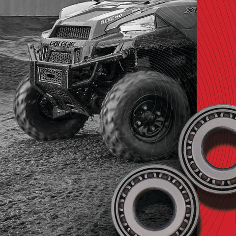 Harley Wheel Bearing Seal Kit Replacement 25-1001 with double lip TC seals and stainless garter spring next to ATV in mud