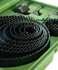 Close-up of Jadever 16-piece bi-metal hole saw set with black teeth in a green case.