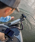Person using G Force Heavy Duty Trolling Motor Replacement Handle With Cushioned Grip And Release Cord Nylon Jacketed Stainless Steel Cable For Tourney Grade Performance Red on boat