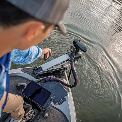 Person using G Force Heavy Duty Trolling Motor Replacement Handle With Cushioned Grip And Release Cord Nylon Jacketed Stainless Steel Cable For Tourney Grade Performance Red on boat