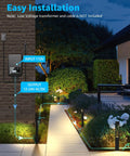 Low voltage pathway lights installed on garden path, showing 12-24V AC/DC input-output diagram, evening setting