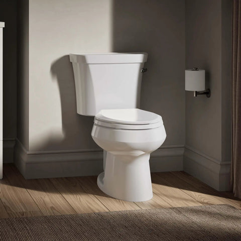 Side view of Wellworth Toilet Tank 1.28 GPF With Right-Hand Trip Lever White, 12-Inch Rough-In Class Five Flushing on wooden floor