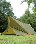 Waterproof 10x10.5 Ft Tarp Shelter For Camping And Backpacking Ripstop 210T Canopy in a wooded campsite setup