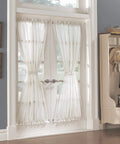 Slick Pair Of Adjustable Swivel Curtain Rods In Crisp White, 21 To 38 Inch with sheer curtains framing French doors.