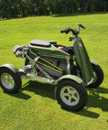 Smooth Operator Electric Single Rider Golf Cart With Foldable Four Wheel Chassis on grass, featuring removable battery and golf bag mount.