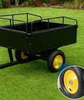Black wheeled garden cart on grass with close-up of wheel hub featuring Rustproof Axle Grease Caps 2 Pack With Galvanized Surface, 1.98 Inch Dust Cap For 2000-3500 Lb Trailer Axles, Heavy Duty Carbon Steel Hub Caps For Boat Trailers, RVs, And Campers Built To Last In Harsh Road Conditions.