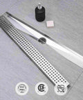 24 Inch Linear Shower Drain With Removable Square Hole Panel in Brushed 304 Stainless Steel, shown on bathroom floor