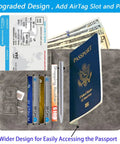 Open grey Passport Holder Wallet With RFID Blocking Leather Card Case For Travel Essentials, showing passport, cards, cash and pen.