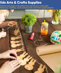 Child crafting with Brown Kraft Wrapping Paper Roll 17.5 x 1200 Inches Non Coated Craft Packing Paper 70 GSM 100 Percent Recycled