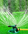 360 Degree Automatic Rotating Sprinkler With 3 Nozzles Easy Setup on green grass, spraying water evenly over lawn