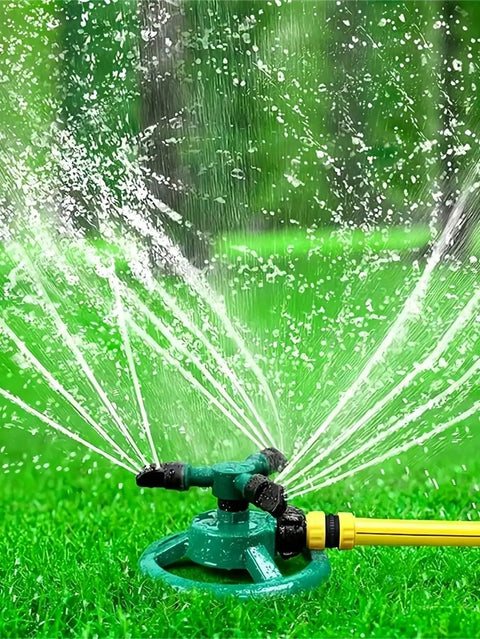 360 Degree Automatic Rotating Sprinkler With 3 Nozzles Easy Setup on green grass, spraying water evenly over lawn