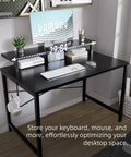Compact 31.5 Inch Computer Desk With Monitor Stand And Headphone Hook For Small Spaces, Black desk setup in corner