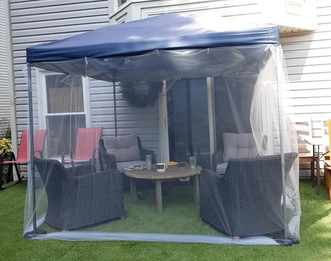 Gazebo with see-through garden netting covering outdoor furniture for insect protection, highlighting UV resistant mesh.