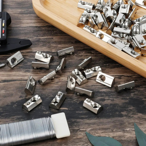 Close-up of 100 Pack M8 T Slot Spring Nuts Built Tough for 40 Series Aluminum Extrusion Carbon Steel Half Round Roll In Nut European Standard