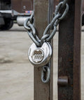 Heavy Duty 80mm Resettable Four Dial Padlock With Chrome Plated Hardened Steel Shackle securing gate with chain