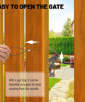 Top Shelf Spring Loaded Gate Latch Cable Pull Kit installed on wooden gate, demonstrating easy outdoor operation with pull ring.