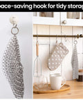 Cast Iron Scrubber With Stainless Steel Chainmail, 8x6 Inch Skillet Cleaner, hanging on a kitchen hook, showing storage option