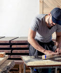 A woodworker using the Workhorse Pro Grade Flush Trim Router Bit Set Four Piece One Quarter Inch Shank Carbide Tipped Premium Alloy.