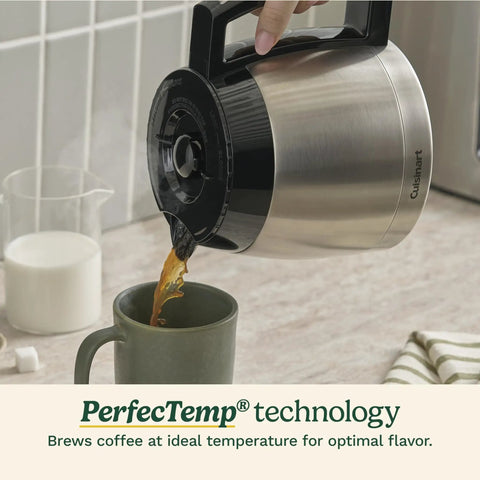 Coffee being poured from PerfecTemp Thermal Carafe of 12 Cup Programmable Coffee Maker into mug, shown on kitchen counter.