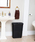 Slim 40L Laundry Hamper With Lid For Tight Spaces Narrow Tapered Design With Ventilated Cutout Pattern For Airflow Durable Plastic Black Laundry Bin