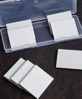 Door corner seals, white foam, self-adhesive, 8 pieces in a clear plastic storage case.