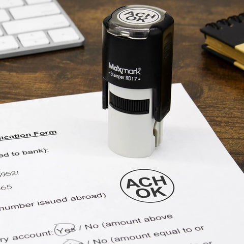 Custom Round Self Inking Stamp With Sleek Pocket Design For Fast Inspections Or Approvals Boasting Smooth Action And Hella Easy Up To Three Line Customizing In Fifteen Bold Ink Shades For Office Crews Wanting A Solid Go To Hand Stamping Tool on a printed application form.