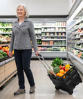 Person shopping with Heavy-Duty Rolling Utility Cart With Collapsible Crate, 60Lb Capacity, Two Oversized All-Terrain Wheels, Black.