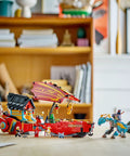 Ninjago Destiny's Bounty Race Against Time 71797 Airship Battle Set with minifigures and dragons in a playroom setting