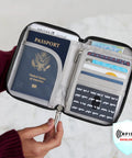 Person holding RFID Blocking Passport Zip Wallet for Safe Travel, Slim Passport Holder with RFID Shield, card slots, and coin pocket.