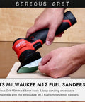 Hand using Milwaukee M12 Sander with Triangle Sanding Sheets 90mm By 65mm Set For Milwaukee M12 Sander With Assorted Grits 80 120 150 180 220 Ten Of Each Heavy Duty Hook And Loop Film Sandpaper Pads 50 Pack Box