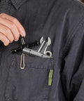 Person holding 4 Way Sillcock Water Key, All In One Steel Tool For Sillcocks Faucets Valves And Spigots, pocket view