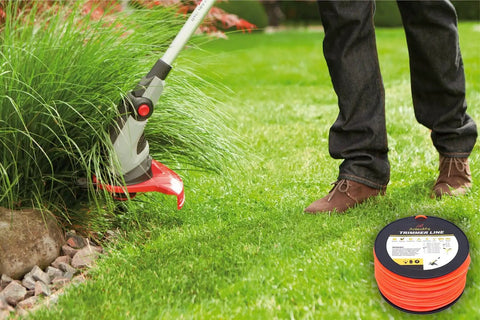Heavy Duty Square Trimmer Line Spool.095 Inch By 1280 Ft With Built In Cutter Orange 5 Pound Pack For Gas And Electric String Trimmers That Cut Through Heavy Weeds And Thick Grass Fast, shown in use on thick grass.