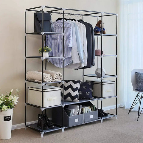 Heavy Hitter Portable Closet Wardrobe Organizer With Slick Nonwoven Fabric Cover And Beefy Steel Frame Built Solid For No Sweat Roomy Storage Shelves And Long Hanging Rod In Soft Gray with clothes and accessories displayed.