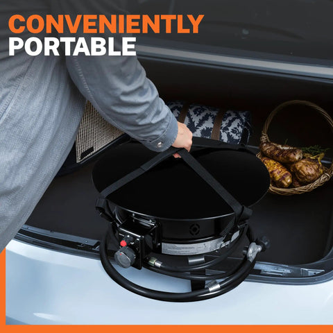 Person placing Lit Propane Fire Pit Smokeless 58000 BTU 19 Inch Outdoor Portable Fire Table with lid in car trunk