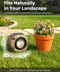 Two Pack Solar Rock Lights Outdoor Adjustable Angle Waterproof LED Garden Pathway Lights next to flower pot