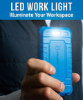 Person holding blue LED work light for illuminating workspace