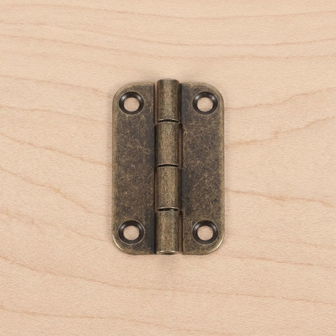 Close-up of a 12 Pcs Small Antique Bronze Iron Cabinet Hinge 1.4 inch with Rounded Corners, Four Hole Vertical Plate, Smooth Action