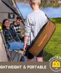 Zeta L8 Max Camping Chair With Carry Bag shown outdoors near tent and lake, easy to carry and lightweight, brown.