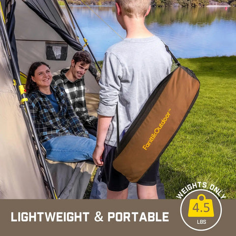 Zeta L8 Max Camping Chair With Carry Bag shown outdoors near tent and lake, easy to carry and lightweight, brown.