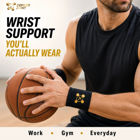 Copper-Infused Wrist Compression Sleeve Providing 20-30 MmHg Support For All-Day Wear Hand Stability For Weightlifting Yoga Bowling And Other Sports 1 Pair Small shown on athlete holding basketball