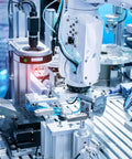 Industrial machine with robotic arm handling components, part of a pneumatic system for quick install and maintenance.
