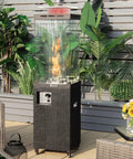 Beast 41,000 BTU Propane Patio Heater With Weatherproof Cover Lockable Wheels Adjustable Feet Tempered Glass Tube CSA Certified Outdoor Heater For Garden Porch And Deck Long Reach Heating Up To 13 Feet in a garden setting.