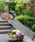 Built Like A Tank Cut Resistant Arm Sleeve Featuring Tough Hppe Knit and Stretch Fit Design for Mechanics Yard Workers and Handy Crews Craving Nuts and Bolts Level Forearm Armor shown outdoors.