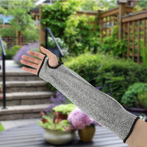 Built Like A Tank Cut Resistant Arm Sleeve Featuring Tough Hppe Knit and Stretch Fit Design for Mechanics Yard Workers and Handy Crews Craving Nuts and Bolts Level Forearm Armor shown outdoors.