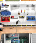 Heavy Duty 12 Outlet Industrial Power Strip With Wide Spaced Outlets And A 15 Foot Cord, 2100 Joules Surge Protection, 15A Circuit Breaker, Double Pole Protection, Metal Housing For Workshop Garage And Office Gear mounted on workbench