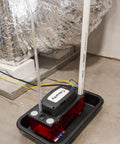 DiversiTech ULTRACP-22 condensate pump with red reservoir and discharge tube.