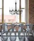Indoor Candle Chandelier 26.5 Inch In Rubbed Oil Bronze Finish With Upward Candle Stem Lights hanging above dining table