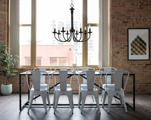 Indoor Candle Chandelier 26.5 Inch In Rubbed Oil Bronze Finish With Upward Candle Stem Lights hanging above dining table