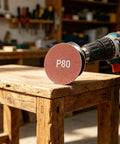 100 Pack 3 Inch 80 Grit Sanding Discs With Hook Loop Backing For Drills And Grinders on a drill, focusing on P80 sanding disc.